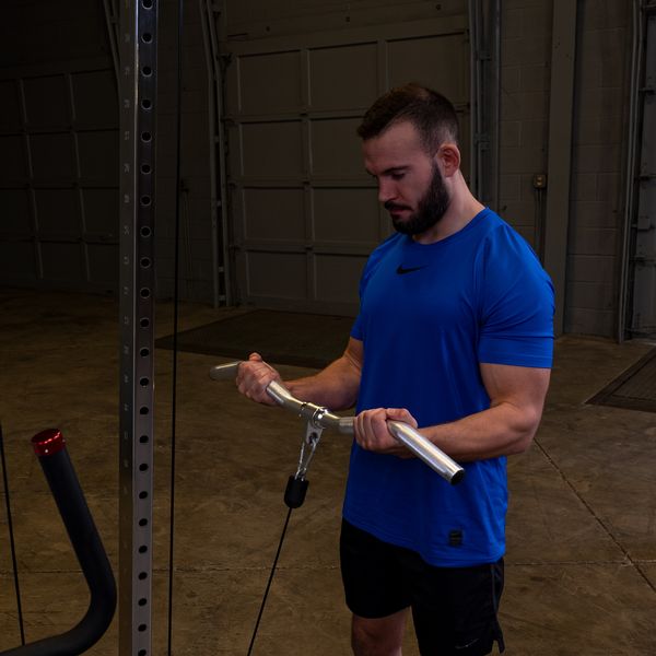 Man Doing Curls With The Body-Solid Aluminum Revolving Curl Bar
